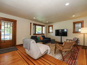 Living area with recessed lighting and light wood-style floors