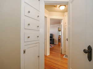 Hallway with light wood-type flooring