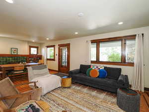 Living room with wood finished floors and recessed lighting