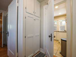 Bathroom with light tile patterned floors and recessed lighting