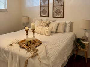 Bedroom featuring dark wood-style floors and ceiling fan