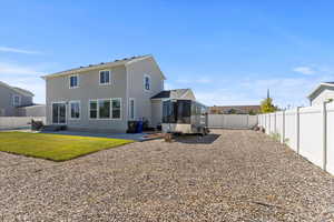 Rear view of house featuring a patio area, a fenced backyard, and stucco siding