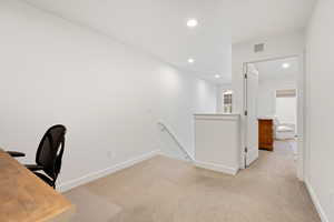 Unfurnished office with light colored carpet and recessed lighting