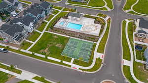 Aerial perspective of suburban area featuring a pool