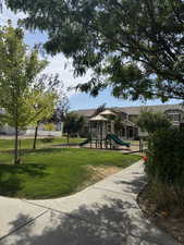 View of community with  lawn and play ground