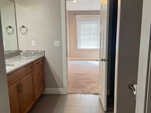 Bathroom with vanity and granite countertops.