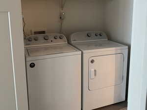 Laundry room featuring washer and dryer included