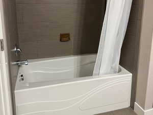 Full bathroom featuring shower / bath combo