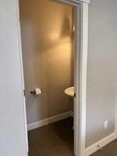 Half bathroom off kitchen and living room