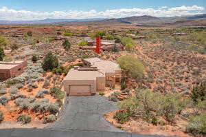 View from above of property with a mountain backdrop