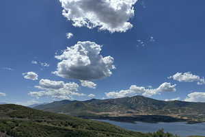 Mountain view featuring a nearby body of water