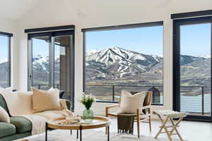 Living area featuring a mountain view and vaulted ceiling