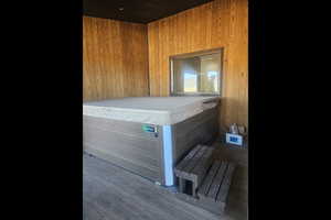 Sauna with wood walls and wood ceiling