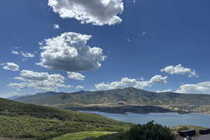 View of mountain backdrop with a nearby body of water