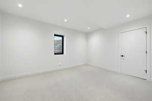 Unfurnished room featuring light colored carpet and recessed lighting