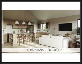 Living area with vaulted ceiling and light wood finished floors