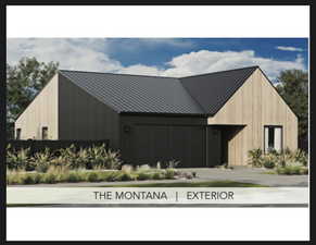 View of property featuring a garage and driveway