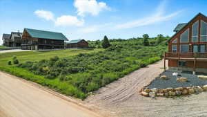 Surrounding community with a wooden deck and a balcony