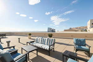 View of patio featuring outdoor lounge area and a mountain view