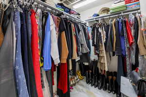 View of primary walk in closet