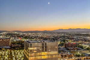 Twilight view of mountain background with nearby urban area