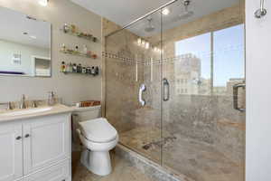 3/4 bath featuring vanity, a stall double shower, and recessed lighting