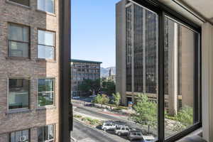 View of city featuring mountains from primary bedroom