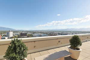 View of patio / terrace with a mountain view and a city view