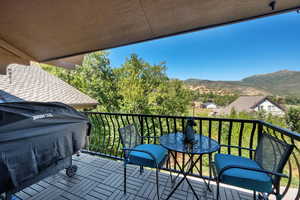 Balcony featuring area for grilling and a mountain view