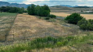 View of mountain backdrop with rural landscape
