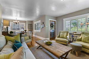 Living room with a chandelier and wood finished floors