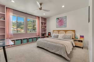 Bedroom featuring light colored carpet, recessed lighting, ceiling fan, and a mountain view