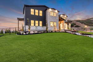 View of front of house featuring stone siding and stucco siding
