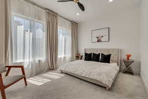 Bedroom featuring carpet, a ceiling fan, and recessed lighting