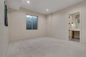 Spare room with carpet and recessed lighting