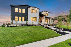 View of front facade with stone siding