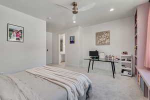 Bedroom featuring light carpet, recessed lighting, a desk, and a ceiling fan
