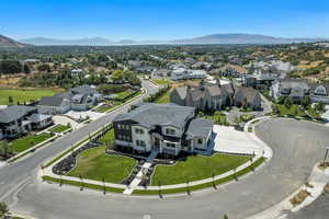 Aerial perspective of suburban area with a mountainous background