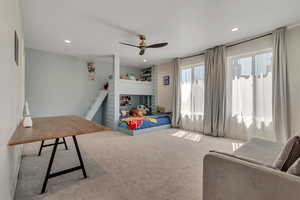 Bedroom with carpet floors, a ceiling fan, and recessed lighting
