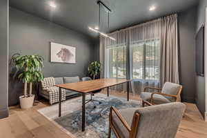 Home office featuring light wood-style flooring and recessed lighting