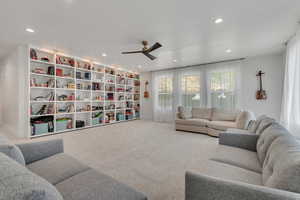 Living area featuring a ceiling fan, carpet floors, and recessed lighting