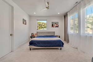 Bedroom with carpet floors, recessed lighting, and ceiling fan