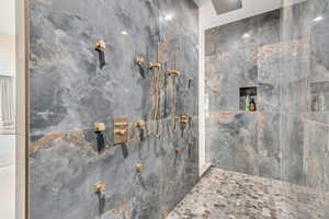 Full bathroom featuring a tile shower