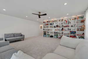 Living area featuring recessed lighting, carpet floors, and ceiling fan