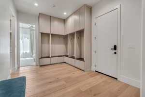 Mudroom with light wood-style flooring and recessed lighting