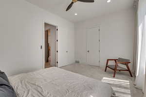 Bedroom featuring recessed lighting, light carpet, and ceiling fan