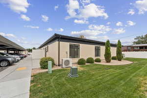Corner view of the condo shows the cute landscaping and the green open space between buildings.