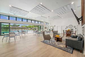 The community building features a wall of doors to let in the light and fresh air.