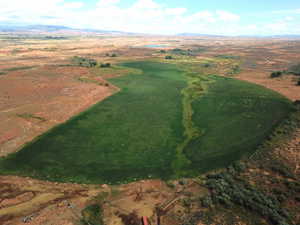 Aerial view of property and surrounding area with mountains and rural landscape