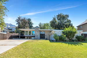 Mid-century home with stone siding